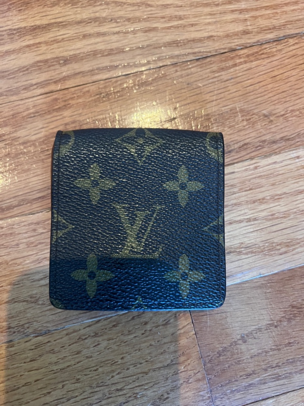 Louis Vuitton Monogram coin purse in Dark Brown and Gold
